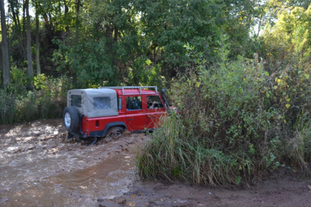 Emlyn's defender takin on the mud