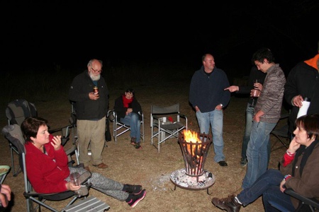 Relaxing and chatting around the camp fire